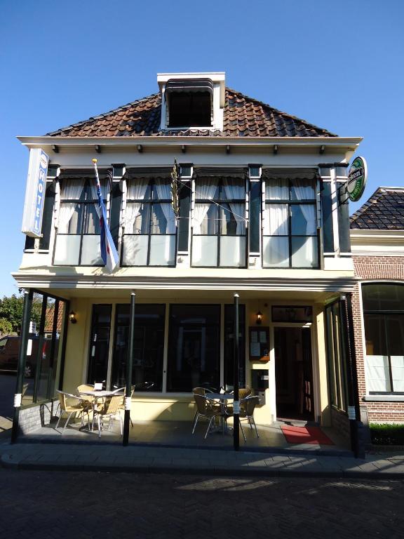 De Gouden Klok Hotell Leeuwarden Rom bilde